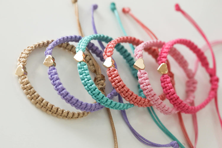 Gold Heart Bracelets available in 6 pastel colors: gold, purple, seagreen, coral, pink, neon pink.