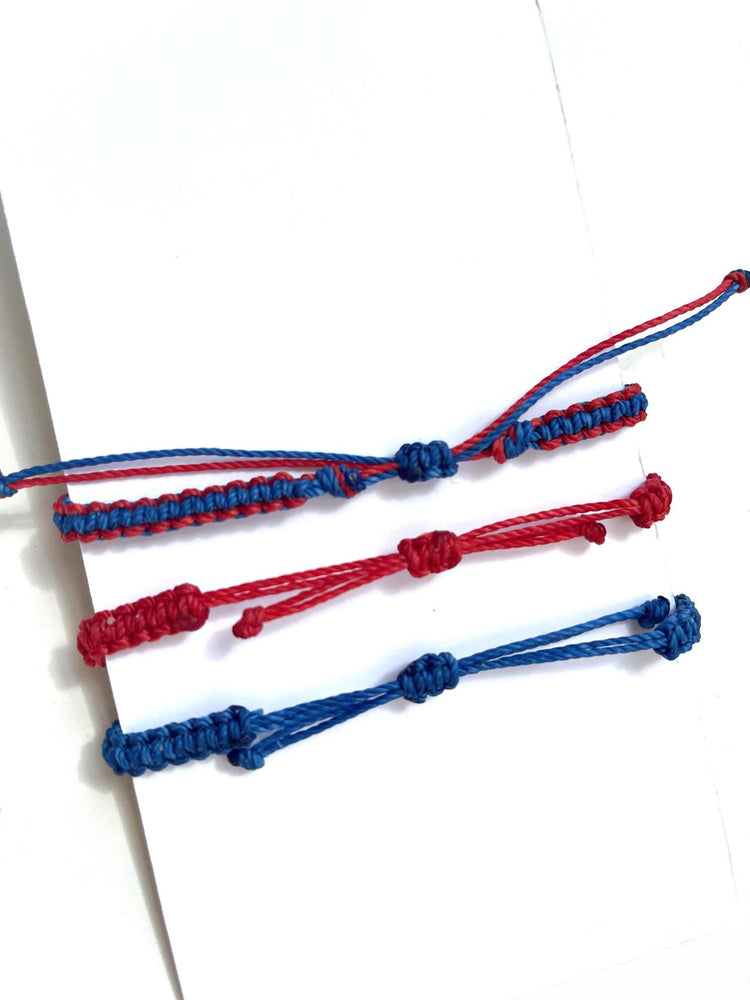 Red and Blue Bracelets. One adult, Two kids. First Day of Kindergarten.