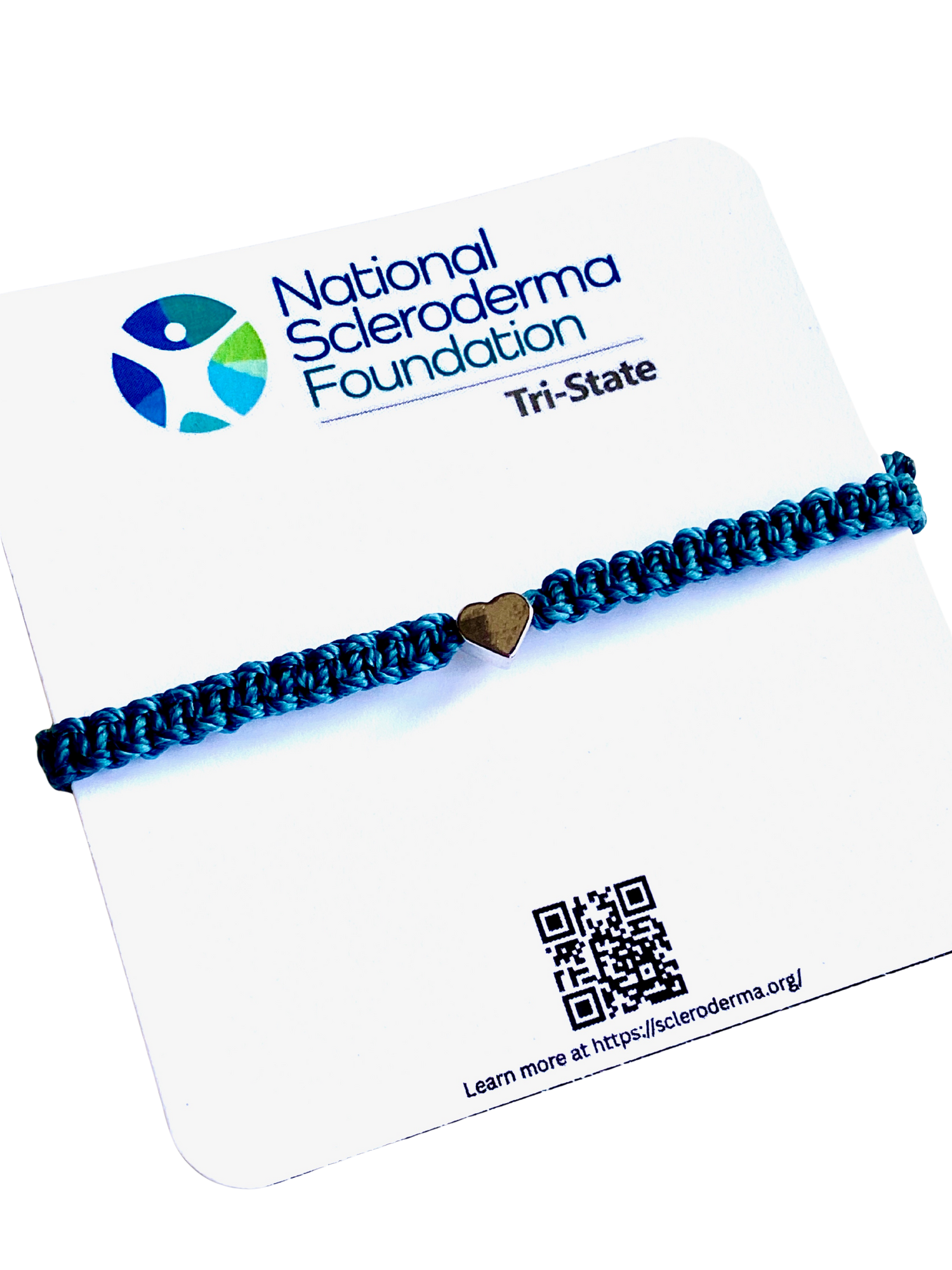 Teal braided bracelet with a silver heart charm on a National Scleroderma Foundation card.
