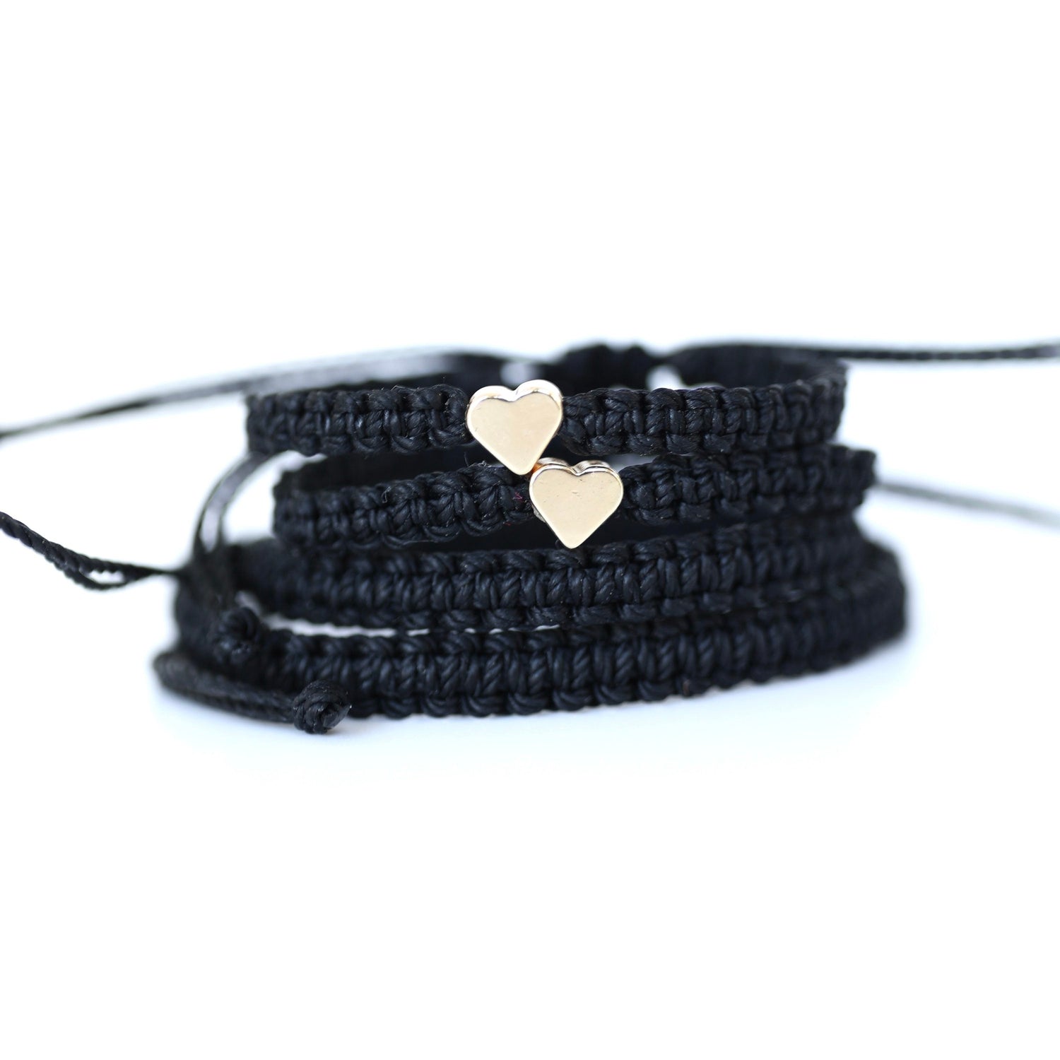 Black matching bracelets with gold heart charms