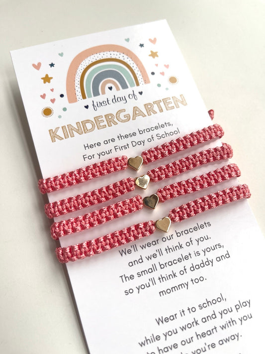 Rainbow card First day of KINDERGARTEN  &#39;Here are these bracelets, For your First Day of School&#39;. Includes 4 bracelets with gold heart charms are on the card.